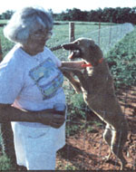 Allison Lockard of Sweetwater, Oklahoma, with one of her greyhounds.